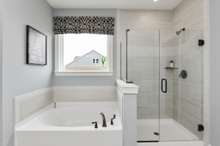 Primary suite features double vanities, tile floors, and tiled shower or tiled shower/garden tub at NO cost!