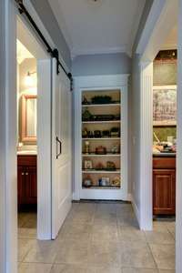 Hidden access between half bath and laundry/mud room