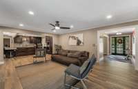 Just off the entry way is this large, open gathering room adjoining the kitchen.  Perfect for gatherings and entertaining.