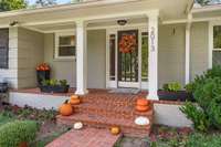 Inviting front porch with Fall seasonal decor