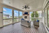 Screen Porch is large and offers outdoor gas fireplace and sliders into the family room