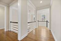 Upstairs has a beautiful landing for a cohesive floorplan