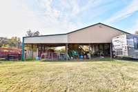 Huge sectioned barn to right of the home with room for hay, storage and/or an arena.