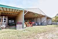 Back side of barn.  Three horse stalls on the left including a birthing stall.