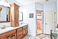 More custom cabinets for ample storage options. Bidet commode included behind door.