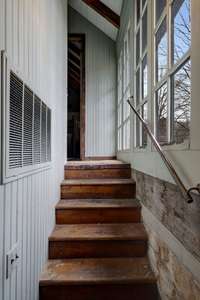 Staircase to the upper level highlighting the three inch thick floors