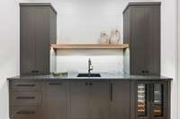 Wet Bar in Bonus Room with wine and beverage coolers + ice maker.