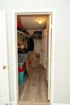 Large primary bedroom walk-in closet that can be entered through the primary bath also.