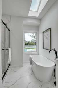 Soaker tub with beautiful sunlight and feature widows