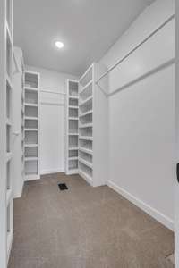 Custom built owners suite walk-in closet