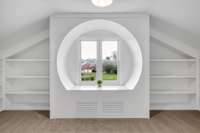 Circular 'reading nook' window with beautiful built-ins