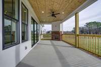 covered back porch with wood burning fireplace