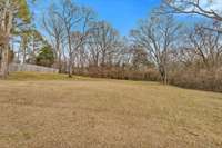 Beautiful fully fenced backyard with mature trees