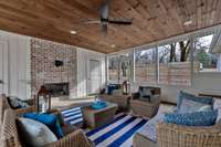 Additional view of the screened in porch with two storage areas