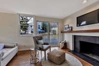 Primary bedroom with fireplace and sitting area