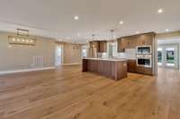 Walking into the living and dining room that is wide open to the brand new kitchen.