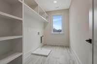 Laundry room with custom shelving.