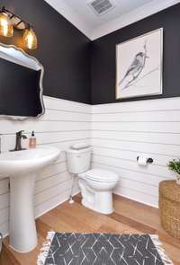 Nice sized powder room downstairs located down the hall from great room! *Picture not of actual home.