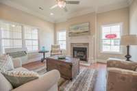 Living room showing crown molding (option) and ceiling fan.