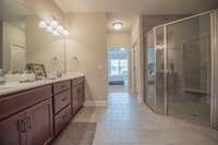 Owner's bathroom suite, Tile floors, walk-in shower stall.  Soaker tub.  Raised double vanities.  Room includes a linen closet and toilet closet.