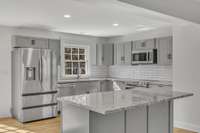 Primary kitchen. New cabinets, new full stainless steel appliance package, granite countertops.