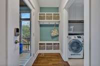 Mudroom nook by the back door, that leads into the laundry room