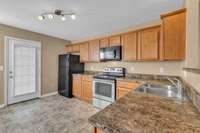 Large kitchen with plenty of cabinets and counter space.