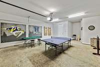 Sealed concrete floor, door opener, the game tables can be stored in the nook at the back to use the garage for parking