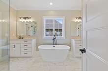 Stand alone soaking tub completes this stunning primary bathroom