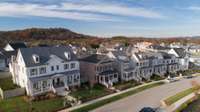 View of a finished street in Southbrooke surrounding by rolling hills.