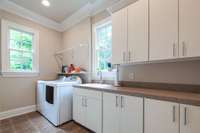 Laundry room area with sink.