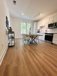 You're greeted by a lovely and open Kitchen concept as soon as you walk up the first set of stairs to the 2nd level! Lots of ways to set up your unique Kitchen!