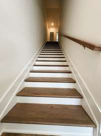 Stairwell to the 3rd floor and both the Master bedroom and the guest bedroom