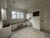 Large Laundry room/Home Center.  *This home is under construction. Photo updated 12/19/23.