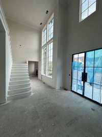 Grand Two-Story Foyer with State-of-the-art Windows!  *This home is under construction. Photo updated 4/9/24.