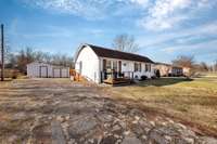 Stone driveway with a view of he storage shed in the back for your lawn mowers and tools.