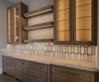 Butler's Pantry with custom cabinetry and designer finishes.  Built by: Schumacher Homes, LLC