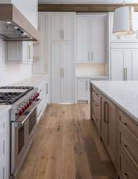 Open Chef Kitchen with state-of-the-art-appliances, custom cabinetry, waterfall island, hidden prep pantry and window over apron front sink.  *this home is virtually staged.  Built by: Schumacher Homes, LLC