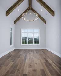 Primary Retreat with vaulted ceiling, accessible to the outdoor living area.  *This home is virtually staged.  Built by; Schumacher Home, LLC