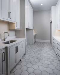 Generously sized Laundry room / home center.  *this home is virtually staged. Built by: Schumacher Homes, LLC