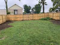 Huge backyard with alley access and brand new privacy fence!