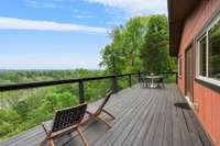 Walk out onto this serene deck and watch the river go by.