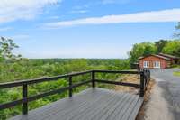 Enjoy this additional walk-out deck by the 2 car detached garage to enjoy the serenity of the 1441 Pawnee Trail.