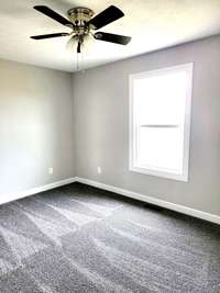 bedroom 1, all 3 bedrooms have ceiling fans and carpet with wonderful padding plus large walk-in closets!