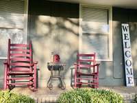HOME HAS A COVERED FRONT PORCH--PERFECT FOR RELAXING AND WATCHING THE SUNSET WHILE THE MATURE TREES GIVE YOU SHADE.