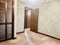 Upstairs Bedroom #2 features comfortable carpeting and a ceiling fan for added comfort