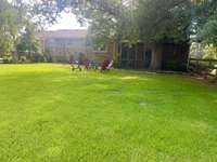 ENJOY AFTERNOON RELAXING IN YOUR NICE BIG FENCED BACKYARD UNDER BIG MATURE SHADE TREES, OR WATCH & LISTEN TO THE BIRDS WHILE RELAXING ON THE SCREENED BACK PORCH