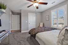 One of the two upstairs bedrooms with a walk in closet