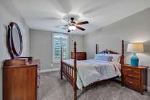 Second of the two upstairs bedrooms - both bedrooms feature walk in closets