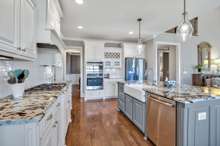 Maple cabinets with pull out & soft close drawers + built in wine rack!